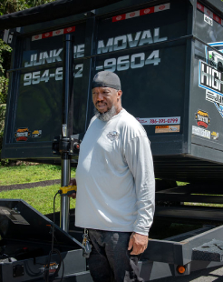 Trustworthy High-Caliber Junk Removal crew member with a professional and reliable junk hauling trailer