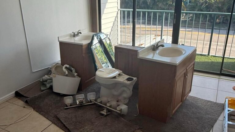 Bathroom fixtures and vanity removed during junk removal at a condo in Pompano Beach