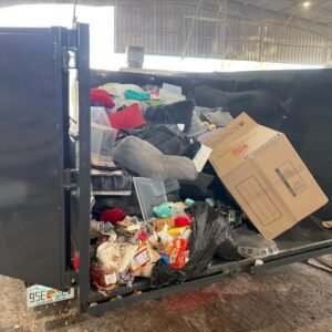 High Caliber Junk Removal trailer loaded with junk