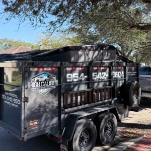 High Caliber Junk Removal loaded dump trailer