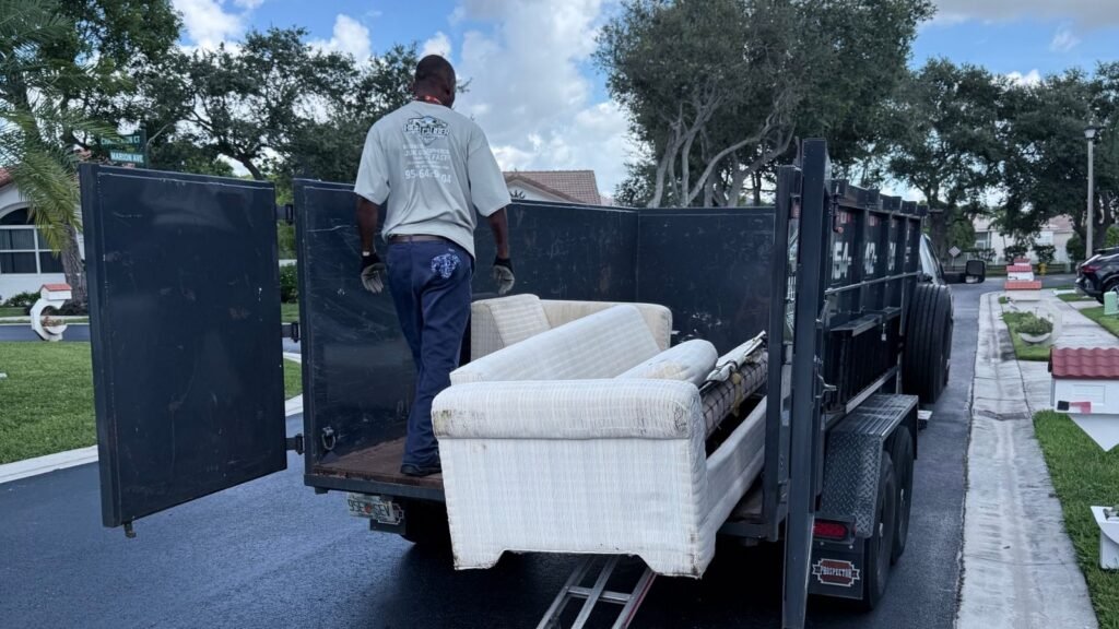 High Caliber Junk Removal crew loading furniture