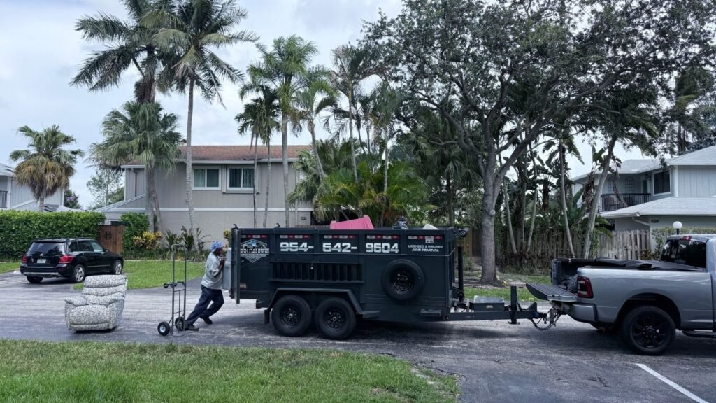 High Caliber Junk Removal trailer at a residential job in Broward County
